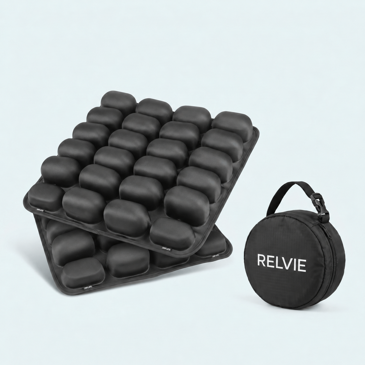 Two black inflatable seat cushions are stacked next to a round black carrying case with 'RELVIE' printed on it.