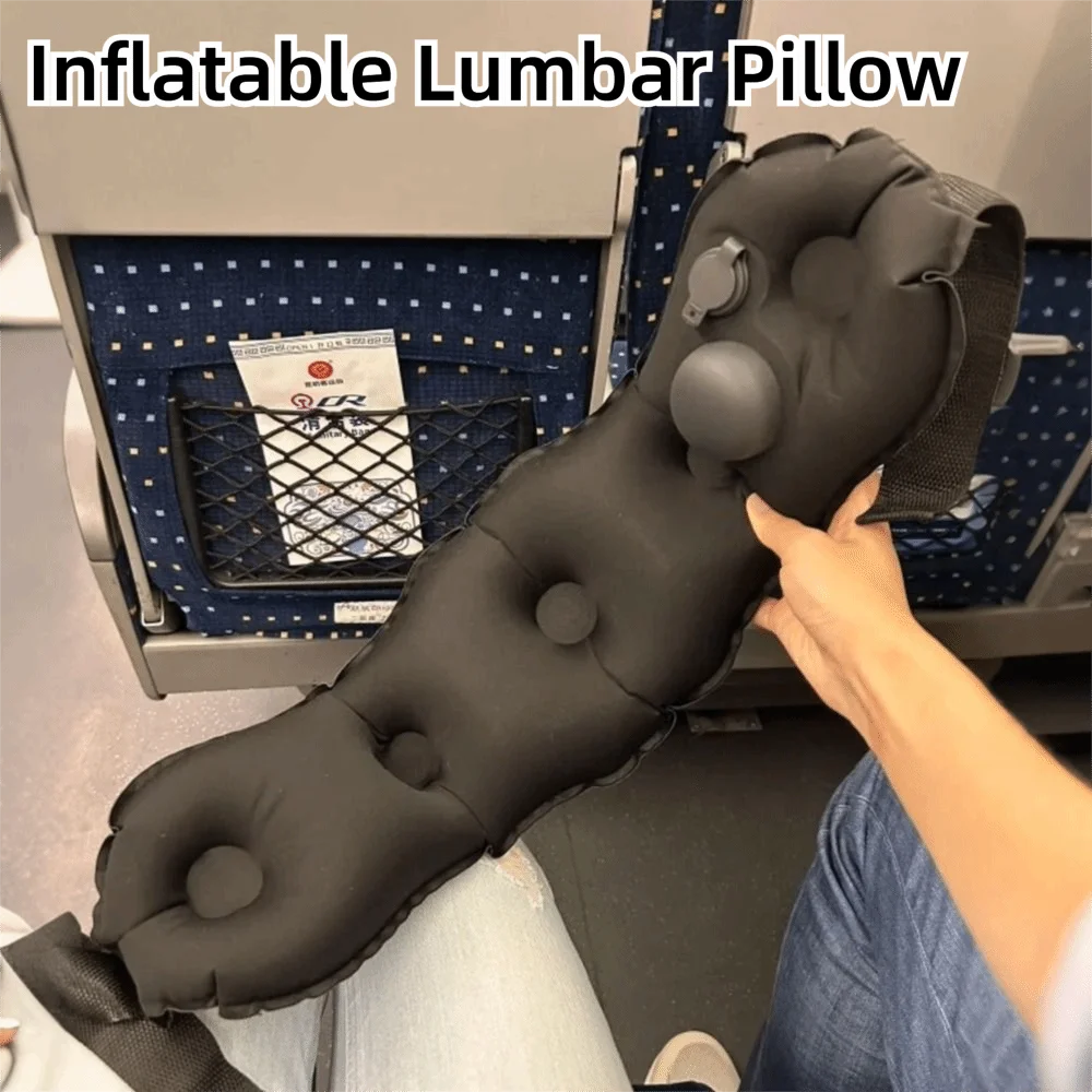 Black inflatable Relvie lumbar cushion held beside a train seat, with strap and valve visible