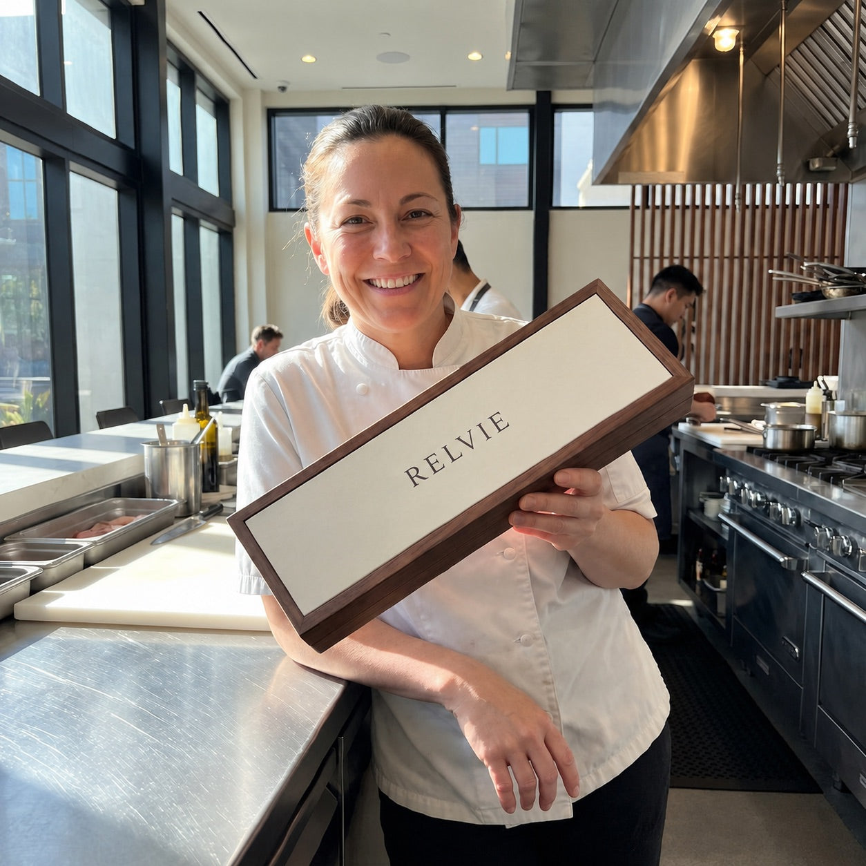 Chef holding RELVIE box in a California kitchen